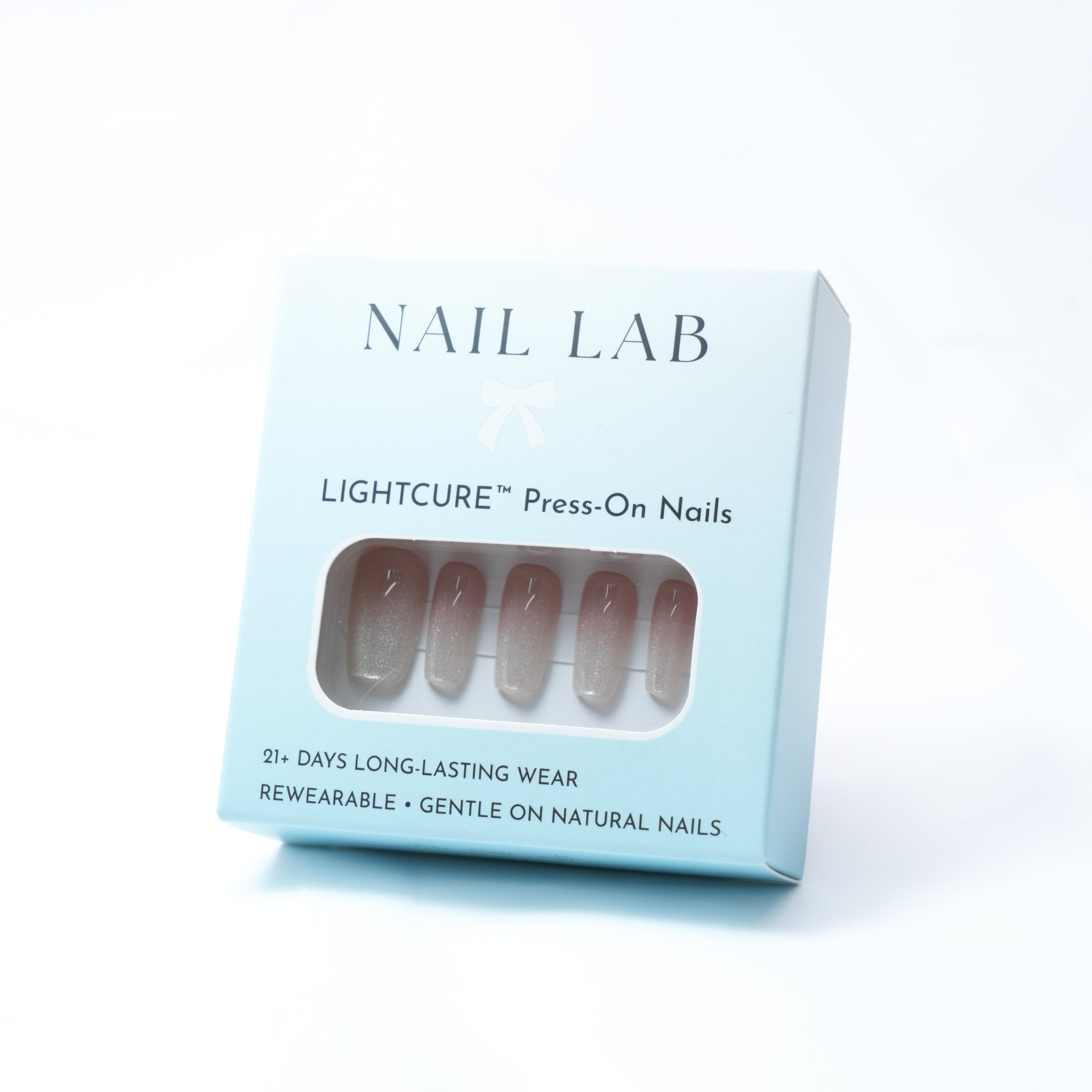 NAIL LAB LIGHTCURE press-on nails in sheer champagne nude with soft shimmer