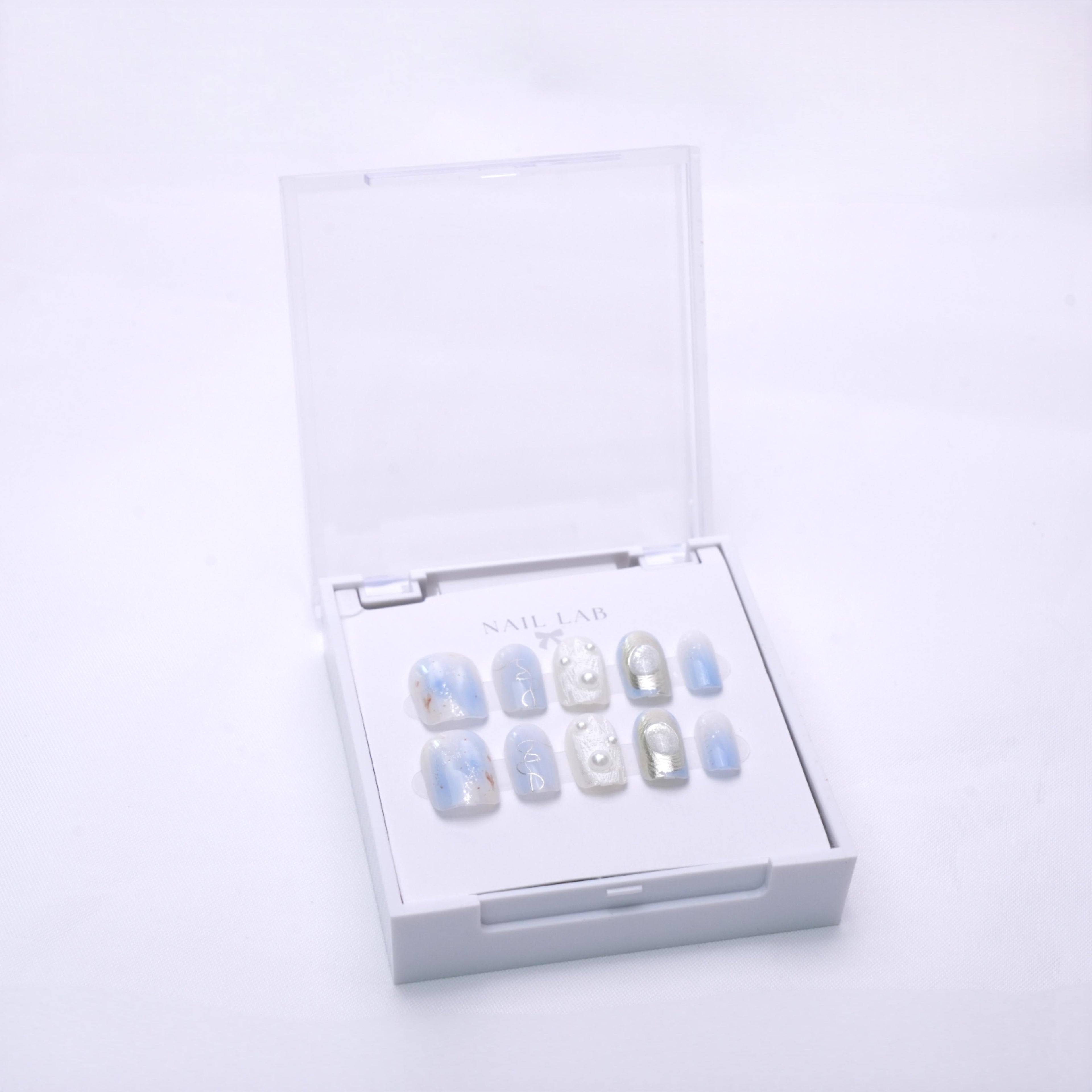 NAIL LAB LIGHTCURE press-on nails in soft frosted nude tones in case