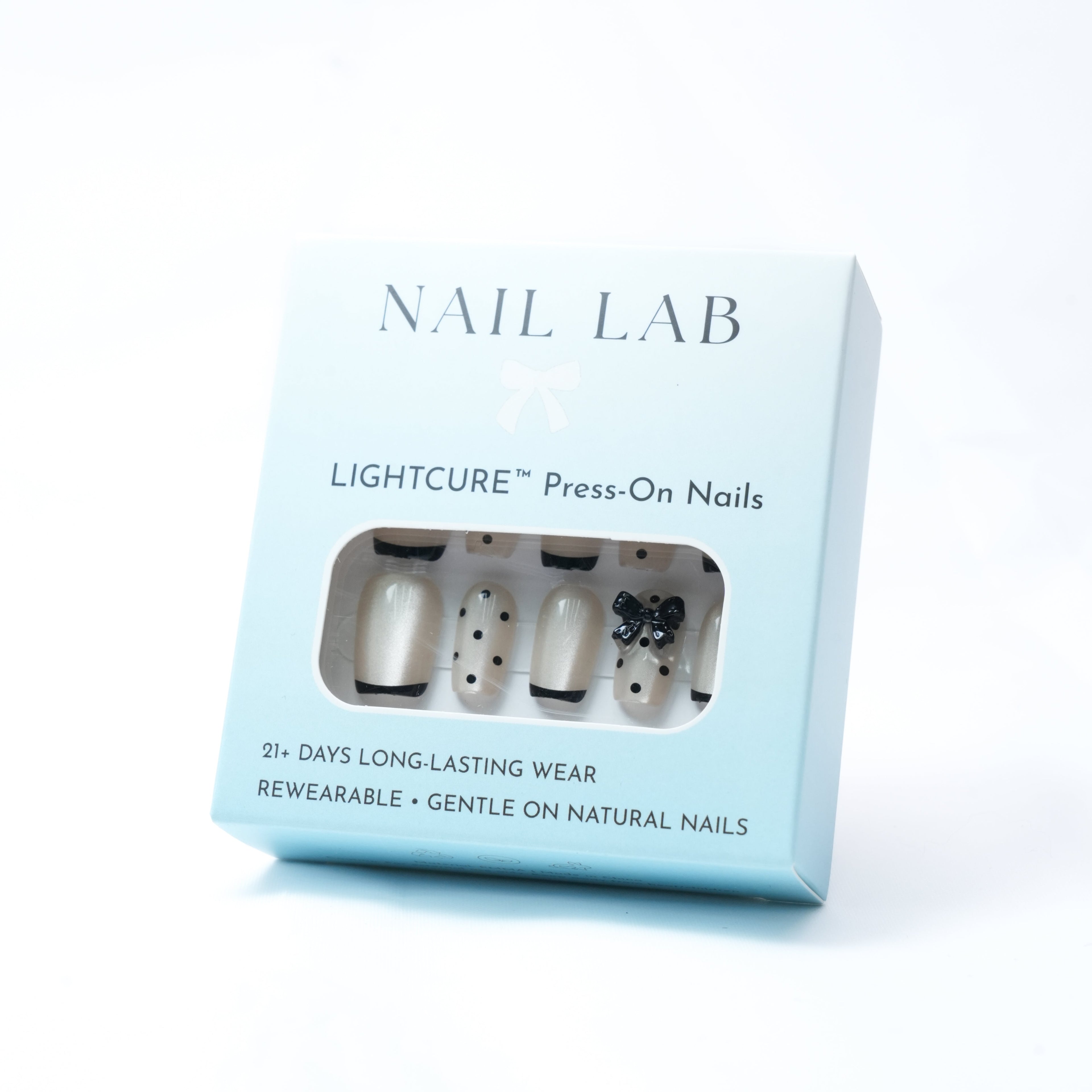 NAIL LAB LIGHTCURE press-on nails in soft nude with bow detail