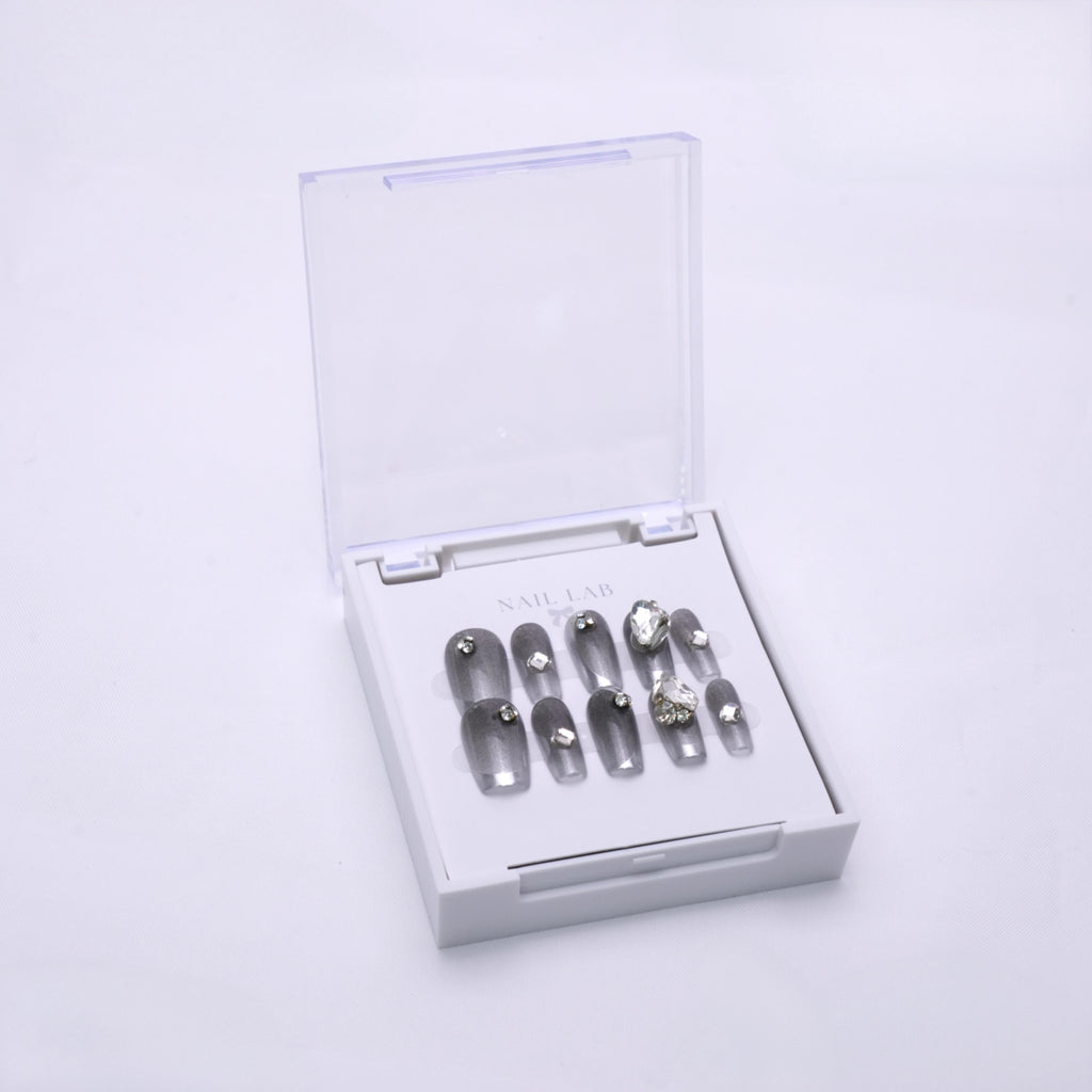 NAIL LAB LIGHTCURE press-on nails in graphite grey with subtle glow in case