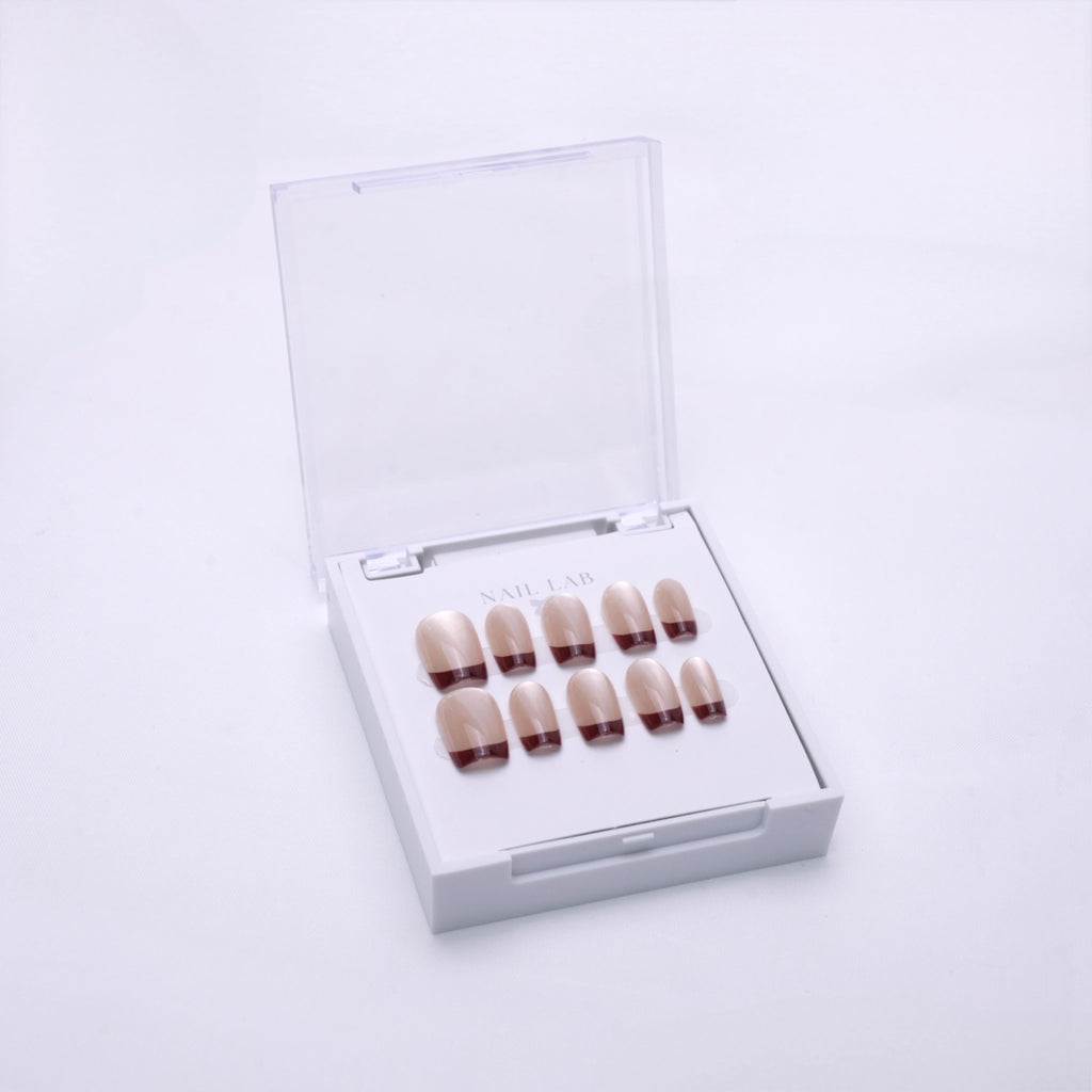 NAIL LAB LIGHTCURE press-on nails in nude with bordeaux red tips in case