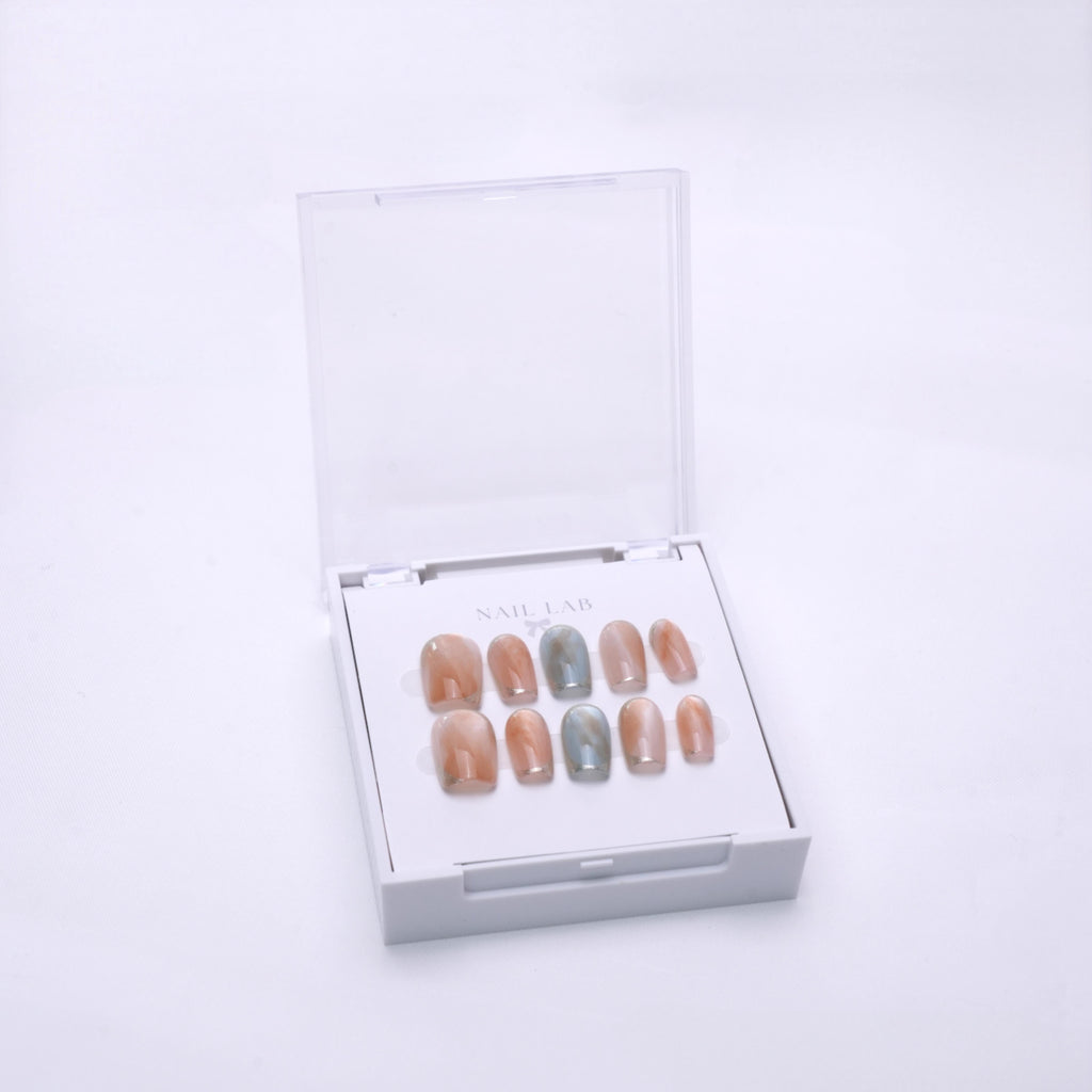 NAIL LAB LIGHTCURE press-on nails in soft sage green tones in case