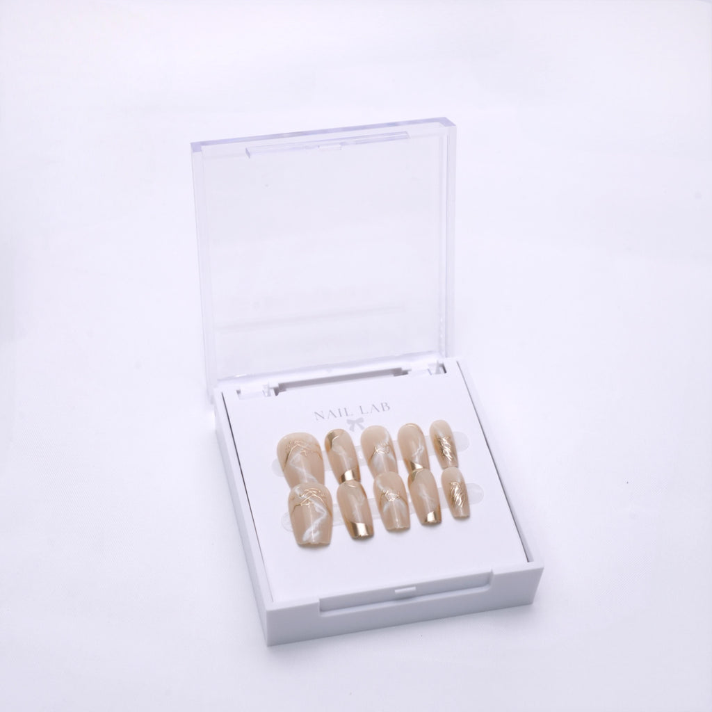 NAIL LAB LIGHTCURE press-on nails in sheer golden nude shimmer incase