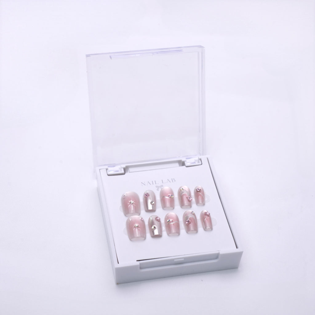 NAIL LAB LIGHTCURE press-on nails in glowing blush pink tones in case