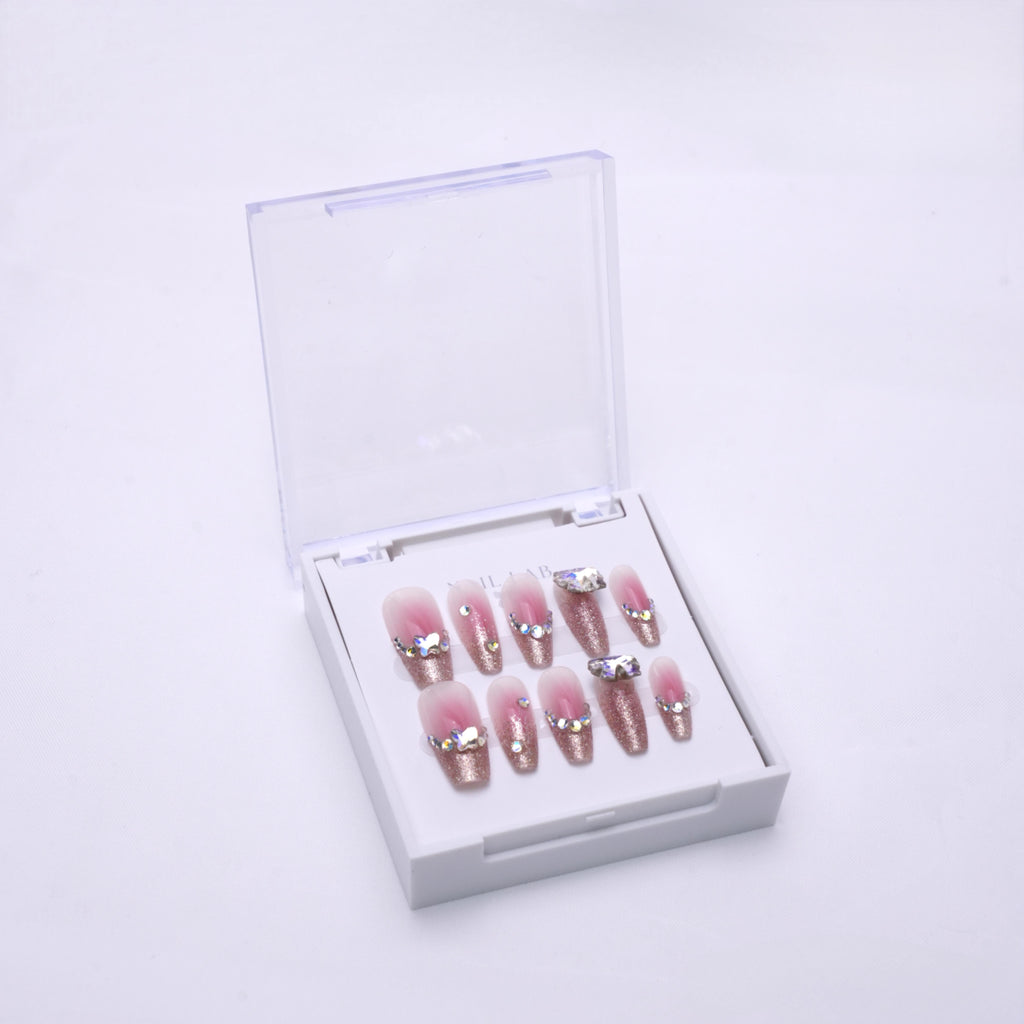 NAIL LAB LIGHTCURE press-on nails in translucent rosy pink tones in case