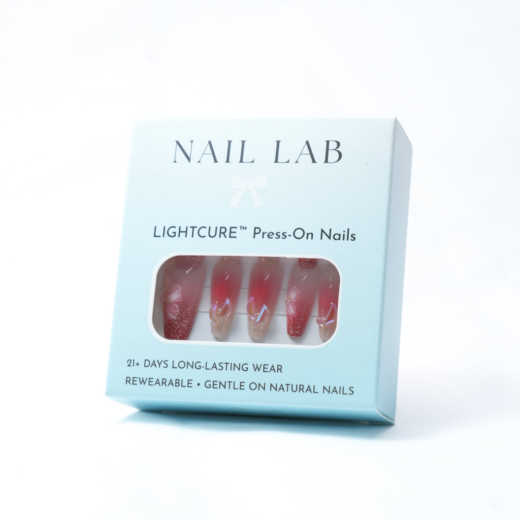 NAIL LAB LIGHTCURE press-on nails in warm nude with petal accents