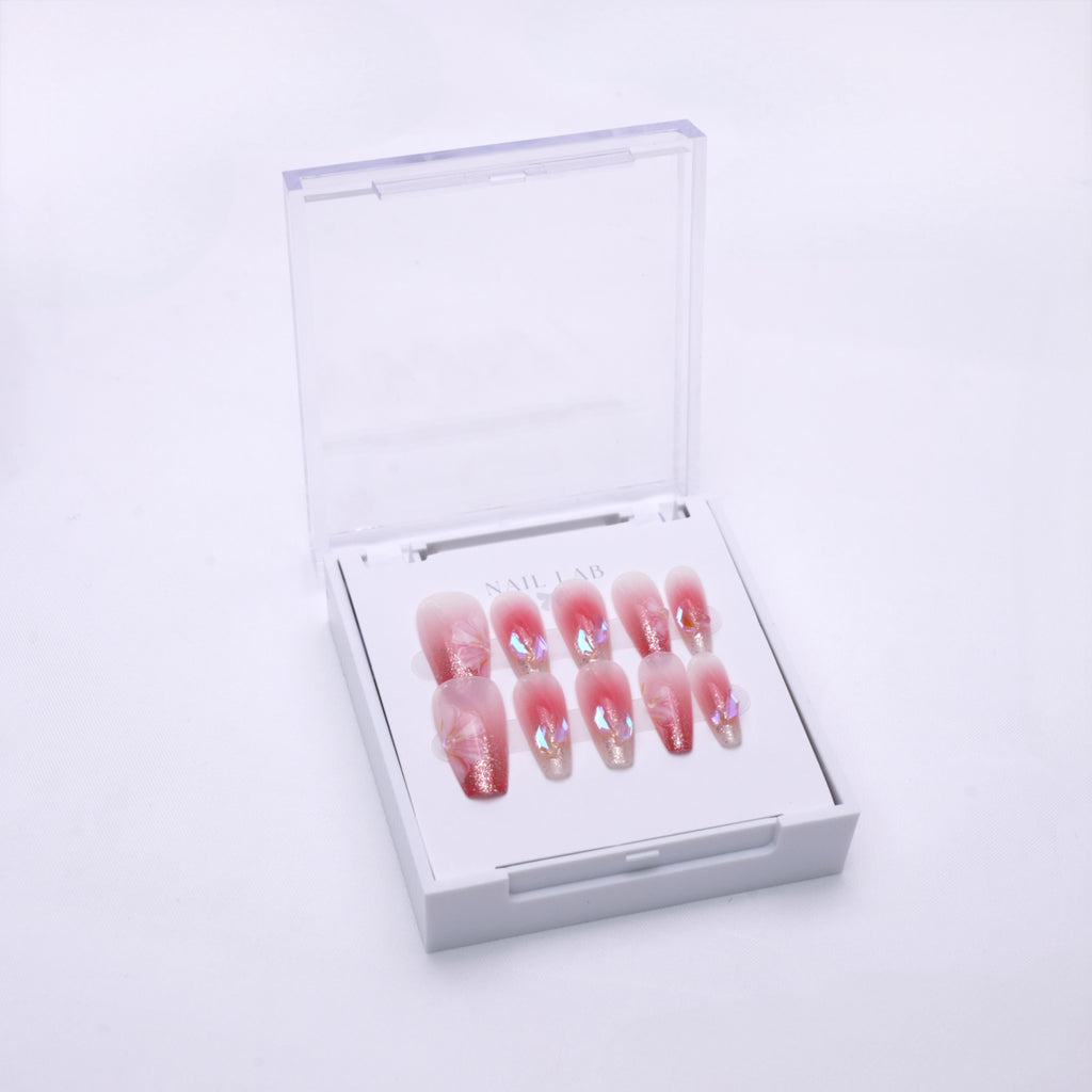 NAIL LAB LIGHTCURE press-on nails in warm nude with petal accents in case