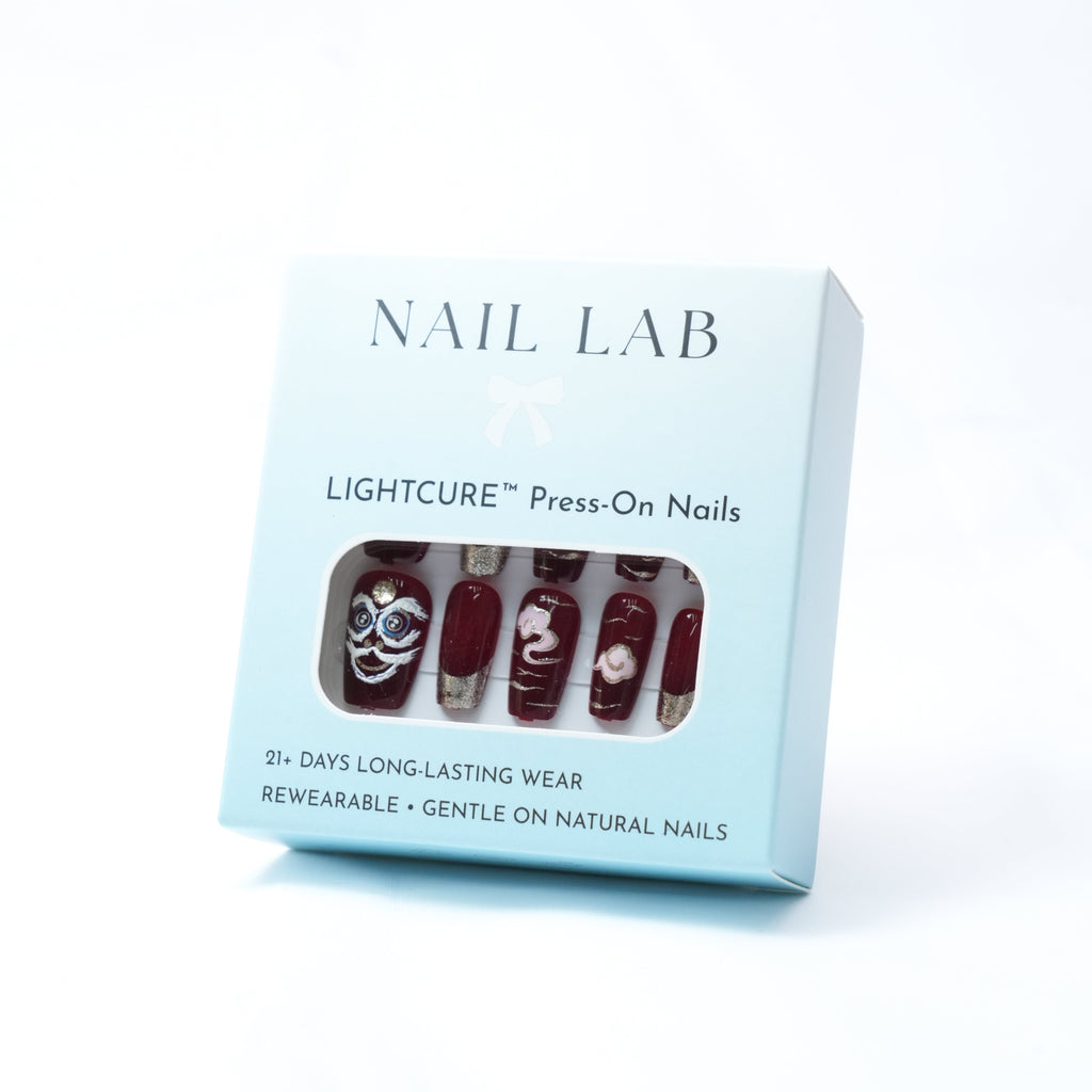 NAIL LAB LIGHTCURE press-on nails in red and gold lunar-inspired design